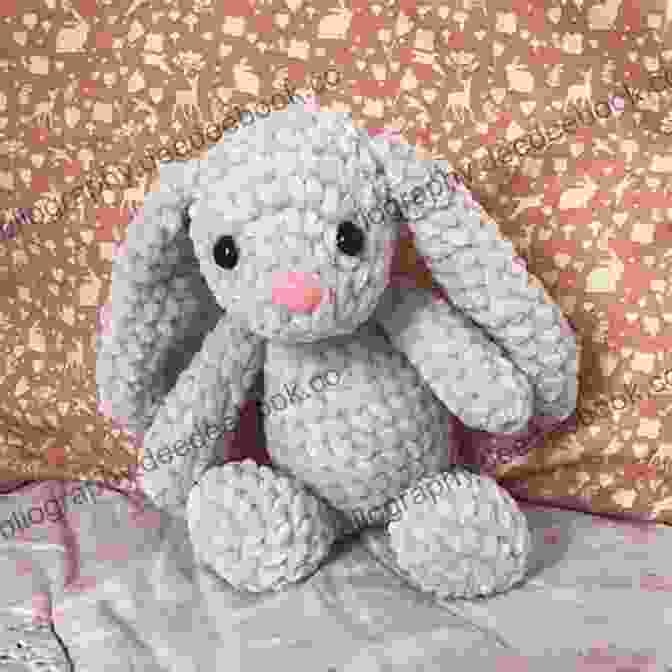 An Energetic Crocheted Bunny Made With Chunky Yarn, Characterized By Its Floppy Ears, Fluffy Tail, And Playful Pose. Mabel Bunny Co : 15 Loveable Animals To Crochet Using Chunky Yarn